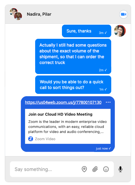 A TalkJS chat interface with a conversation between two people about shipping volumes and warehousing. In the right of the top header of the chat there is a video icon. In the conversation itself, one of the participants shares a link to a zoom call.